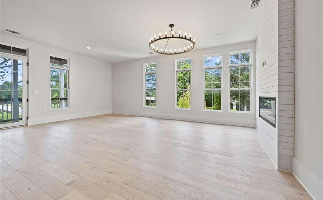 ide-plank oak hardwood floor installed in a new construction great room by Top Floors Carpet One in Suwanee GA