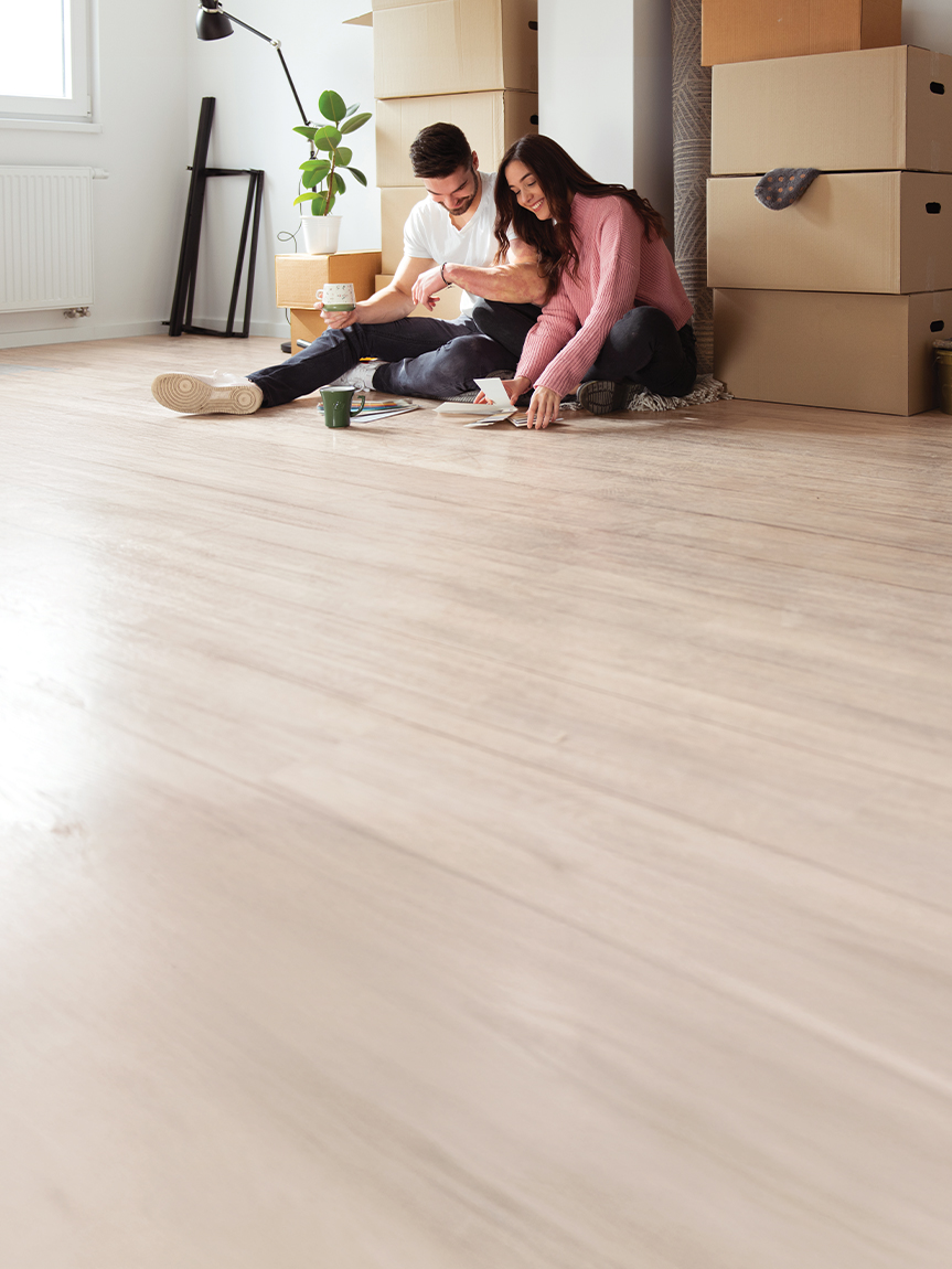 Simply Beautiful Flooring Sale at Top Floors Carpet One in Suwanee, GA — couple choosing flooring sa